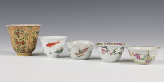 A 19th Century Chinese tan ground tea bowl decorated with flowers 7cm, 4 smaller tea bowls decorated with figures and fish 