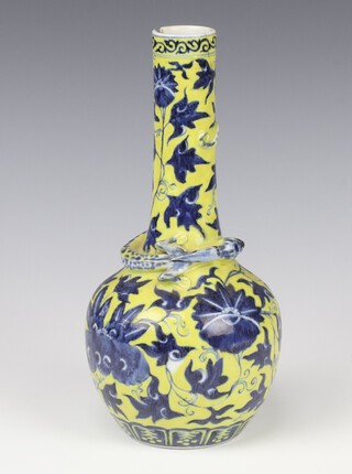 A Xuantong mark and period bottle vase, the yellow ground decorated with flowers and a lizard in relief, 4 character mark, 24cm 