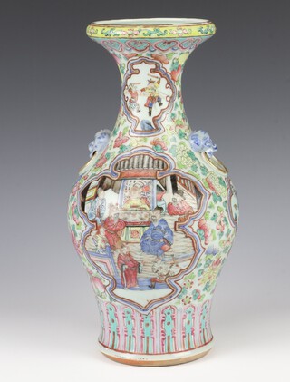 A 19th Century Chinese famille rose oviform vase decorated with panels of figures in pavilion interiors, with smaller panels of figures at pursuits on a ground of flowers and birds with lion ring handles, 33cm 