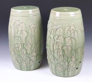 A pair of modern Thai Celadon barrel garden seats decorated with bamboo and insects 54cm 