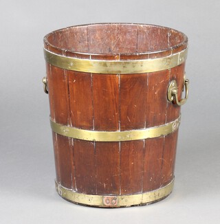 A 19th Century coopered mahogany and brass banded twin handled peat bucket of waisted form 40cm h x 37cm diam. 