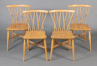 A set of 4 mid-Century Ercol beech and elm stick and rail back dining chairs, the bases impressed B.S.C.F 1960 2056 78cm h x 40cm w x 42cm d (seats 25cm x 32cm) 