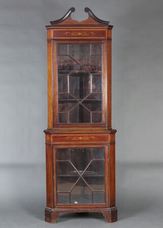 An Edwardian inlaid mahogany double corner cabinet with broken pediment, both sections fitted shelves enclosed by astragal glazed panelled doors 203cm x 71cm w x 50cm d 