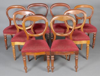 A harlequin set of 8 mahogany balloon back dining chairs, 4 with drop in seats, a pair with over stuffed seats (1 with cresting rail a/f) and 2 singles with over stuffed seats, 86cm h x 44cm w x 38cm d 