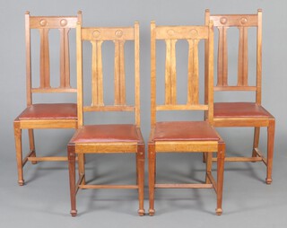 A set of 4 Art Nouveau Liberty style slat and bar back dining chairs with upholstered seats raised on square tapered supports with H framed stretcher and spade feet, bases marked RDNO 439433 110cm h x 45cm w x 41cm d (seats 25cm x 26cm)  