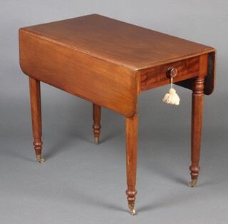 A Victorian mahogany Pembroke table fitted a drawer raised on a hexagonal tapered base ending in caps and casters 72 cm h x 91cm x 49cm