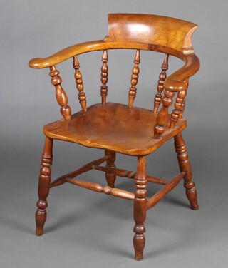 A 19th Century beech and elm tub back smokers bow armchair with bobbin turned decoration and double H framed stretcher raised on turned supports 83cm h x 70cm w x 42cm d (seat 31cm x 30cm) 