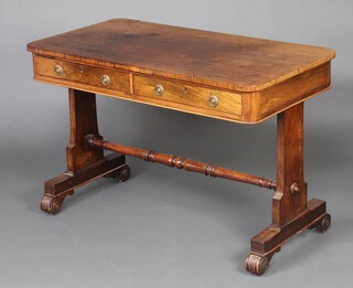 A Victorian rosewood library table fitted 2 frieze drawers, raised on standard end supports with scroll feet 72cm h x 109cm w x 58cm d  