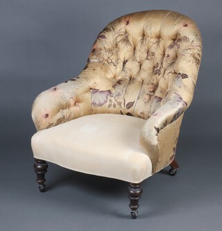 A Victorian armchair upholstered in white and floral material with green loose cover 83cm h x 64cm w x 53cm d