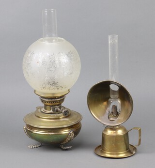 An Edwardian chamber oil lamp with circular shade and glass chimney 35cm h x 13cm diam. together with a brass oil lamp with etched shade and chimney 45cm h x 18cm 