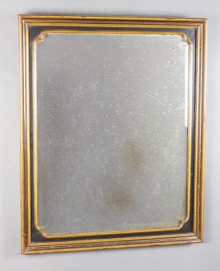 A Victorian bevelled plate mirror contained in a black and gilt frame 68cm x 56cm 