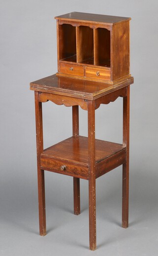 An Edwardian mahogany writing table, the upper section fitted pigeon holes above 2 short drawers with flap over and an undertier fitted a drawer, raised on square supports 107cm h x 34cm w x 34cm d 