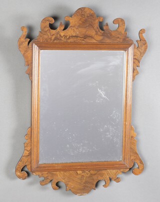 A Chippendale style mirror contained in a figured walnut frame 52cm h x 36cm w 