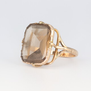 A yellow gold, testing as 9ct, smoky quartz ring 7.1 grams, size R 1/2 