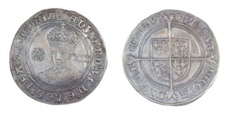 United Kingdom, Edward VI, 1547-1553, silver Shilling, 32mm, 6.3g. Obv: Facing crowned bust of Edward with Tudor rose to the left and denomination to the right / Rev: Quartered shield of arms over long cross fourche. S.2482, VF. 