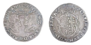 United Kingdom, Philip and Mary,1557 silver Sixpence, 27mm, 2.8g. Obv: Facing profile busts, crown above dividing date / Rev: Garnished oval shield of arms, crown above. S.2506, VF 