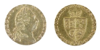 United Kingdom, George III 1798 25mm gold Guinea, 8.5 g. Obv, Laureate head of George, right / Rev, Crowned quartered shield of arms in the shape of a spade. S.3728, EF. 	
