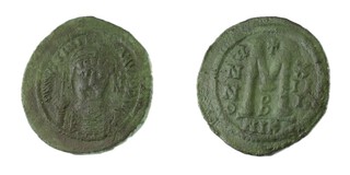 Byzantine Empire, Justinian I, Nicomedia, 527-565, bronze Follis, 41mm. Obv: Helmeted and cuirassed facing bust holding globus cross, cross in right field / Rev: Large M, cross above. S.201 	