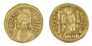 Byzantine Empire, Justinian I (527-565) gold Solidus, 21mm, 4.3g. Obv: Helmeted bust of Justinian, facing, holding globus cruciger and shield / Rev: Angel standing facing, holding long linear cross and globe. S.139, VF. 