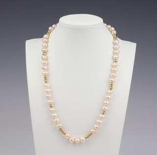 A strand of cultured pearls with gold spacers and a 9ct gold clasp 47cm 