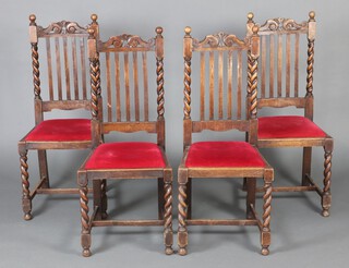 A set of 4 1930's oak framed stick and rail back dining chairs with spiral turned columns to the side and upholstered drop in seats, raised on spiral turned supports with H framed stretcher 106cm h x 45cm w x 40cm d (seat 22cm x 23cm) 