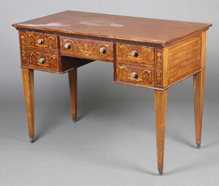 An Edwardian inlaid mahogany dressing table fitted a 1 long and 4 short drawers, raised on square tapered supports ending in brass caps and casters 79cm h x 107cm w x 56cm d 