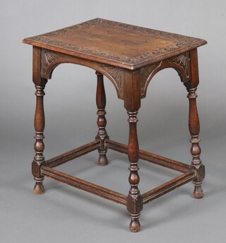 A Victorian rectangular carved oak occasional table, raised on turned and block supports with box framed stretcher 68cm h x 61cm w x 46cm d 