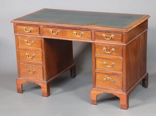 A 19th Century mahogany kneehole desk with green inset writing surface above 1 long and 8 short drawers with brass swan neck drop handles 77cm h x 123cm w x 65cm d 