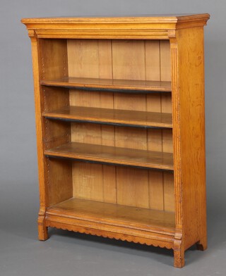 A Victorian light oak open bookcase with fluted decoration to the side, fitted adjustable shelves 137cm h x 105cm w x 37cm d 