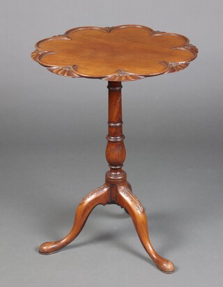 A 19th Century Chippendale style circular snap top supper table, raised on a turned column and tripod base  70cm h x 53cm diam. 