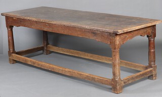 A 17th/18th Century oak refectory table, raised on turned supports with box framed stretcher 77cm h x 235cm l x 79cm w 