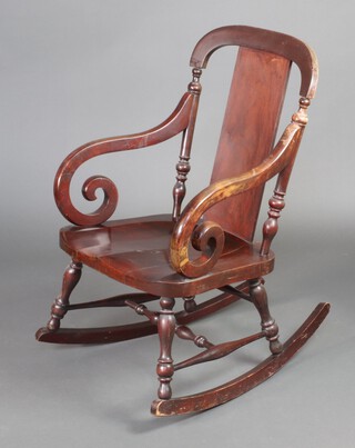 A 19th/20th Century mahogany slat back rocking chair with solid seat and turned stretcher 92cm h x 58cm w x 74cm d (seat 30cm x 31cm) 