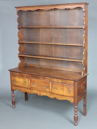 A Georgian oak dresser base fitted 2 short drawers with later associated raised back and moulded cornice, fitted 3 shelves, 212cm h x 158cm w x 50cm d 