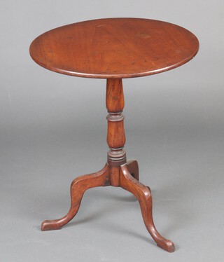 A 19th Century circular mahogany snap top wine table, raised on turned column and tripod base 71cm h x 60cm diam.  