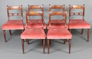 A set of 6 19th Century mahogany carved bar back dining chairs with pierced mid rails, over stuffed seats, raised on turned supports 