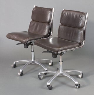 A pair of Italian mid-Century chrome and brown leather upholstered revolving office chairs 84cm x 50cm w x 45cm d 