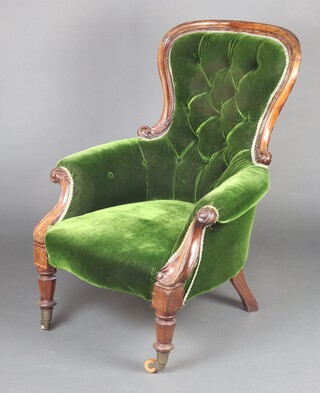 A Victorian mahogany show frame chair upholstered in green buttoned material, raised on turned supports 99cm h x 64cm w x 70cm d (seat 27cm x 38cm) 