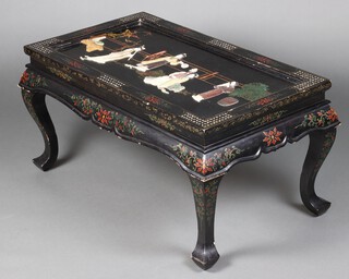 A 1950's rectangular chinoiserie style black lacquered coffee table, the top inset hardstone and bone figures of musicians 47cm h x 91cm w x 51cm d 