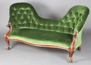 A Victorian mahogany show frame double spoon back sofa upholstered in green buttoned material, raised on cabriole supports 92cm h x 157cm w x 61cm d (seat 121cm x 45cm) 