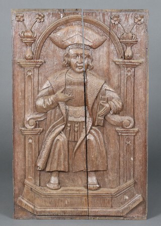 A 17th Century carved oak panel depicting a standing man with book 69cm h x 44cm w 