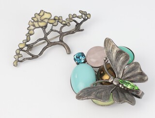 A white metal and hardstone brooch in the form of a butterfly by P Ferrandis for Jaeger 6cm together with an enamelled Art Nouveau style brooch in the form of a tree 7cm 