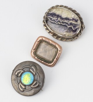 An Art Nouveau silver and enamelled brooch by Charles Horner Chester 1910, a gilt memorial brooch and a silver mounted Blue John brooch 