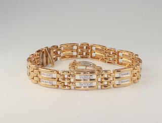 A 10ct yellow gold diamond set bracelet, 18.5cm, diamonds 0.45ct, 22.2 grams (with spare link) 