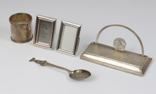 A silver napkin ring Birmingham 1911, a teaspoon with dog finial, a letter holder and other minor silver plated items, weighable silver 49 grams 