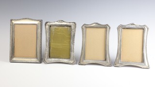 A pair of Art Nouveau silver photograph frames Birmingham 1928, 17cm and 2 silver plated ditto, all dented 