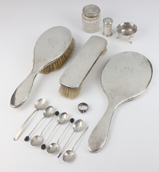 An Edwardian silver topped inkwell Sheffield 1909, a silver backed hand mirror, clothes brush, hair brush, pepper, salt, ring, 6 bean end coffee spoons and a teaspoon, weighable silver, 100 grams gross 