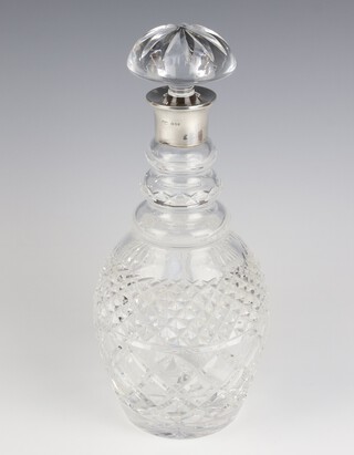 A cut glass mallet shaped decanter and stopper with silver collar, London 1981, maker Mappin & Webb, 39cm, boxed  