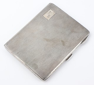 An Art Deco silver engine turned cigarette box with engraved monogram Birmingham 1943, 138 grams, 11cm 