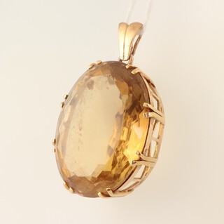 A yellow gold, testing as 14ct, oval citrine pendant, 45mm x 30mm, 33.1 grams 