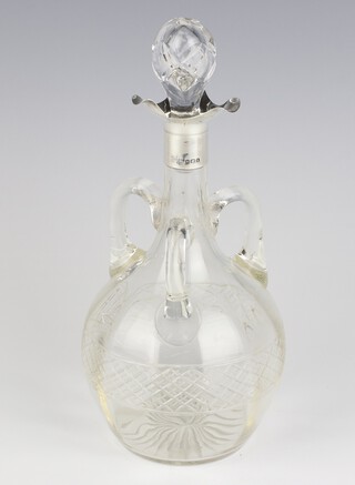 A cut glass spirit bottle with triform silver spout Birmingham 1909, 24cm 